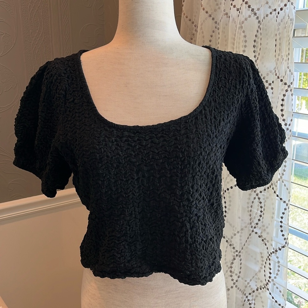 Smocked short sleeved top.